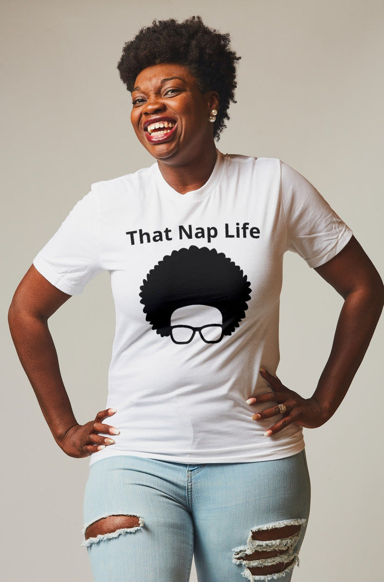 Lady with afro textured hair smiling wearing a beautiful t-shirt.